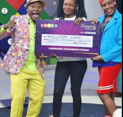 Hope Ligami’s Outrageous Gambling Winning Streak Raises Eyebrows Serial Winner Hope Ligami holds a dummy cheque, posing alongside lottery draw presenters. Picture/Courtesy