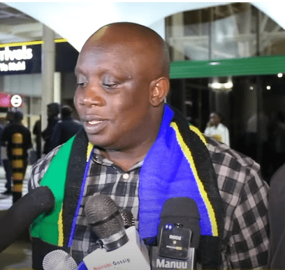 Cassypool Trashes Kenya in Epic Rant, Praises President Suluhu Cassypool arrives at JKIA with his shoulders draped with the Tanzanian flag. Picture/Courtesy. Cassypool's Trashes Kenya in Epic Rant, Praises President Suluhu